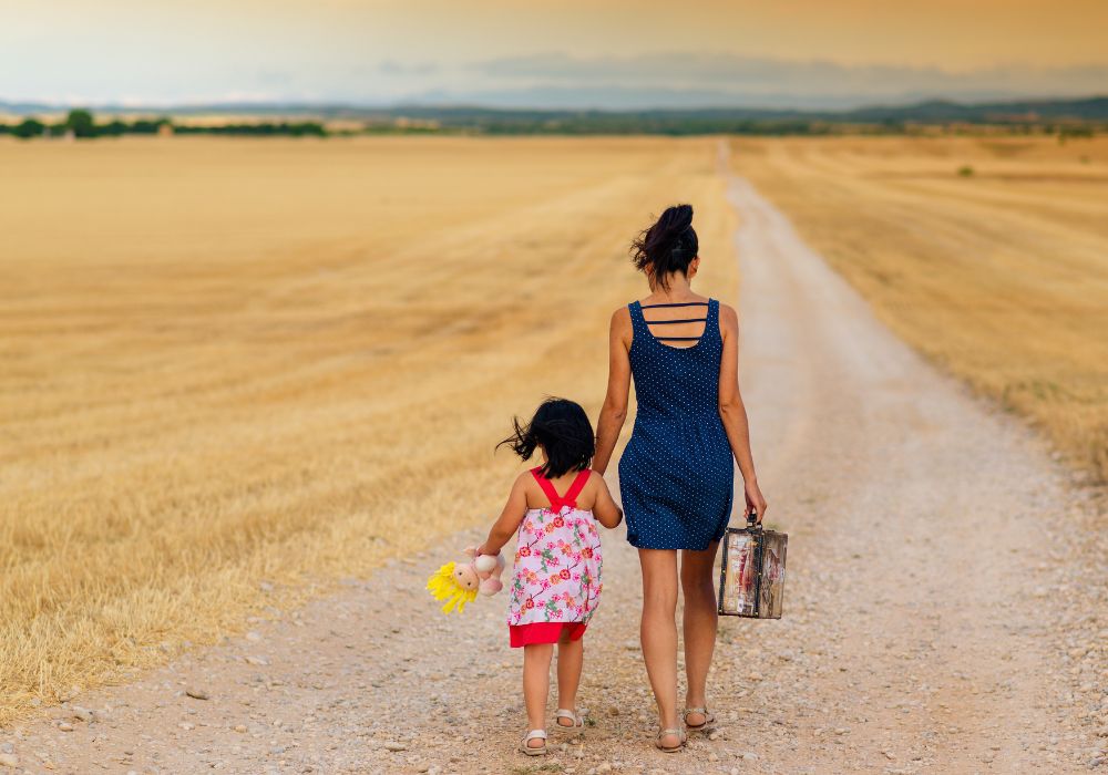 Woman and child walking away