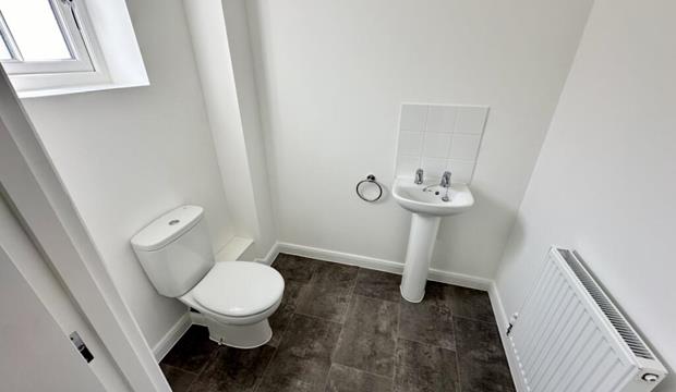 Downstairs WC with toilet, wash basin and radiator Downstairs WC with toilet, wash basin and radiator