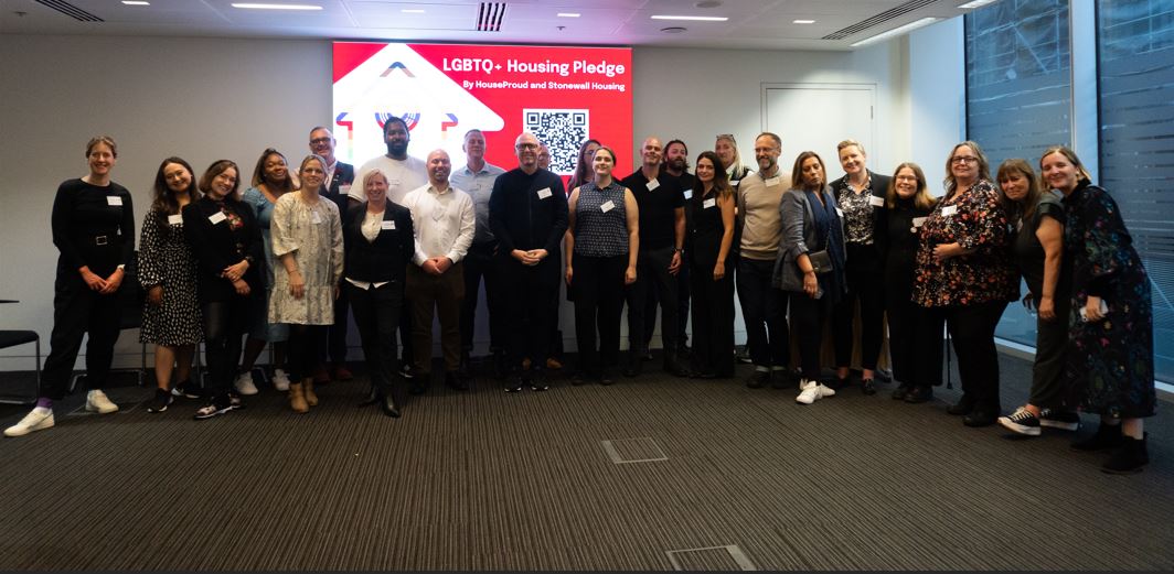 Image Of People Posing For Picture At Housing Pledge Awards