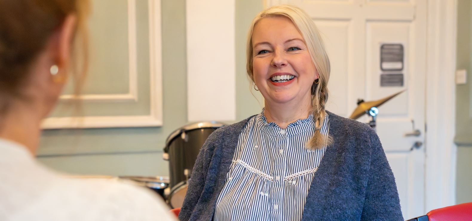Female Colleagues Talking And Smiling In Conversation