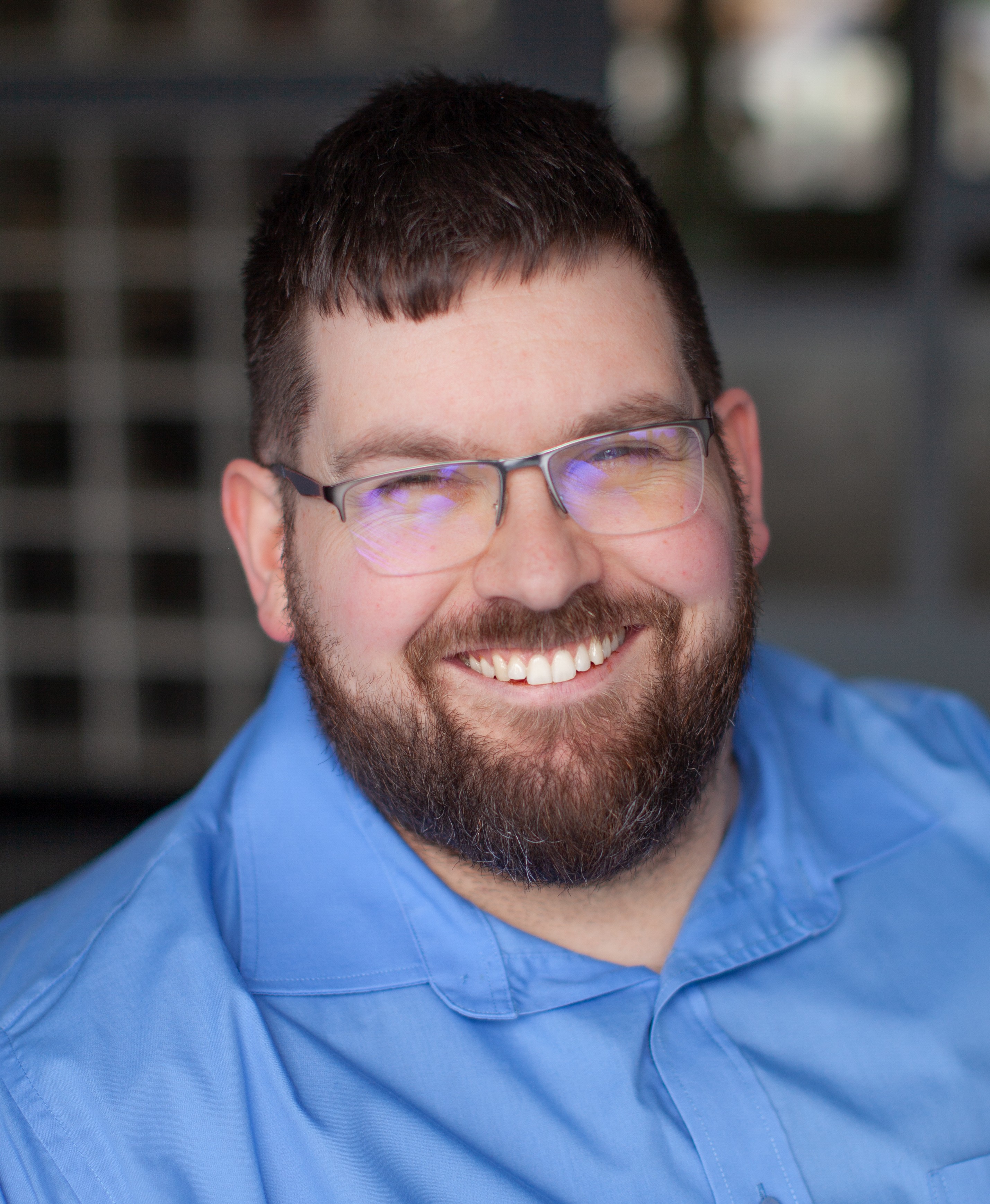 Headshot of Tom Fadden, the CEO of Purple Reach