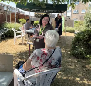Orwell colleague talking to a Orwell Heights resident.